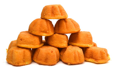 closeup of a pile of plain muffins on a white background
