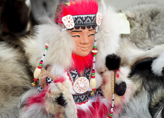 Figure of  shaman in national clothing made of fur with ornaments. Northern people. Eskimo.