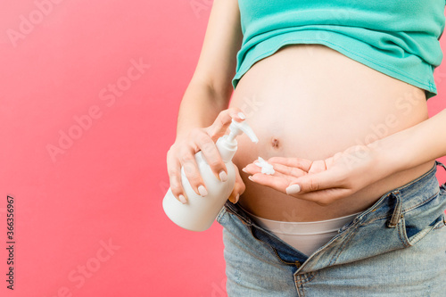 Pregnant Woman In Unzipped Jeans 