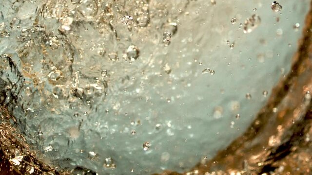Beautiful slow-motion splashing. The yummy syrupy liquid in 1000+ fps. Works for cider, beer, prosecco, pink wine, apple juice, juice, rum, liquor, rye whiskey. Refreshing cold beverage.