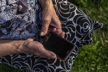 Senior old woman with smartphone
