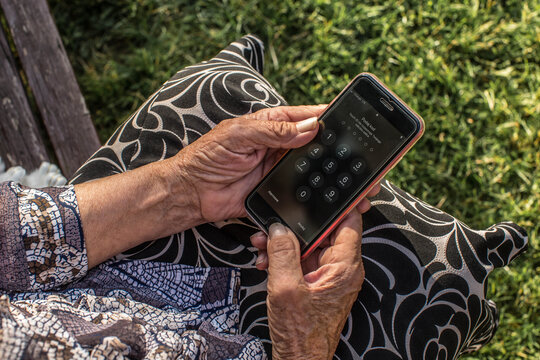 mobile phone in old hands