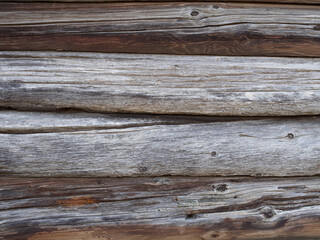 Aged weathered wooden log cabin wall background