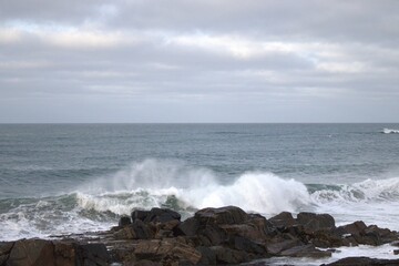 waves crashing on rocks