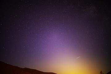 Starry sky at night in the Tyrolean Alps. Moonrise