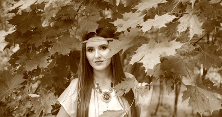 happy hippie girl walks among the trees. stylized film