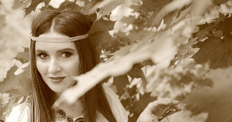 happy hippie girl portrait walks among the trees. stylized film
