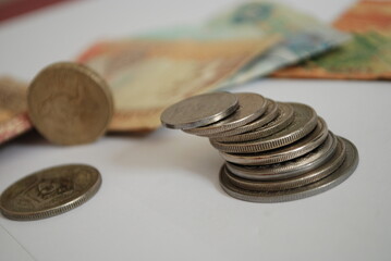 isolated coins and currency,financial concept with selective focus on subject,