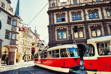 Retro tram driving on the street in Old Town of Prague, Czech Republic. Famous travel destination