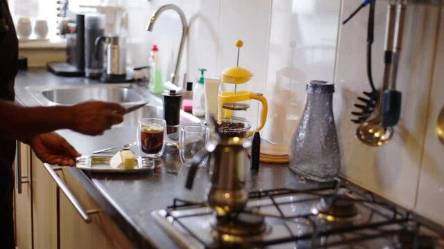 Top view person preparing bulletproof coffee with pods