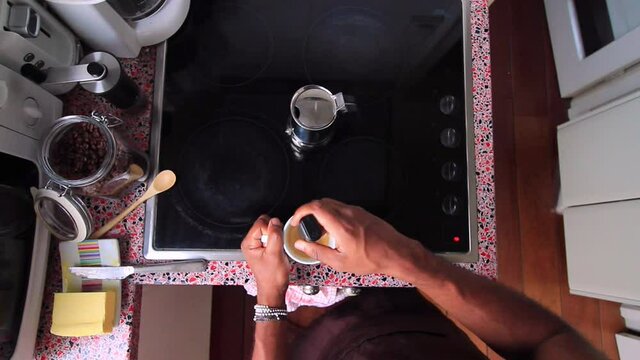Top view person preparing bulletproof coffee with pods