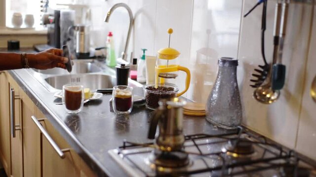 Top view person preparing bulletproof coffee with pods