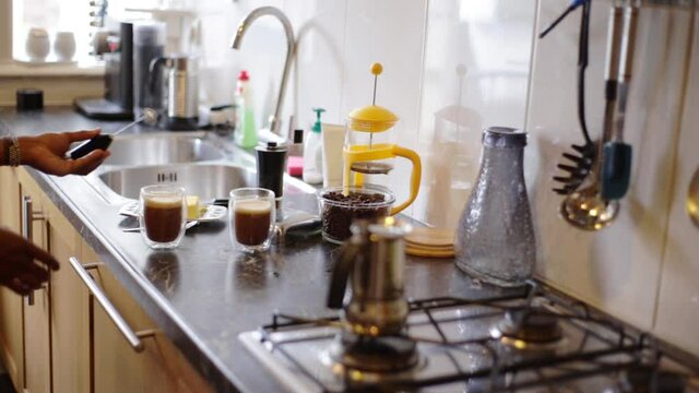 Top view person preparing bulletproof coffee with pods