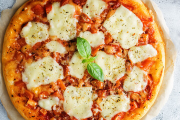 Pizza Margarita with tomato sauce and Mozzarella cheese