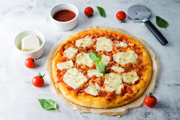 Pizza Margarita with tomato sauce and Mozzarella cheese