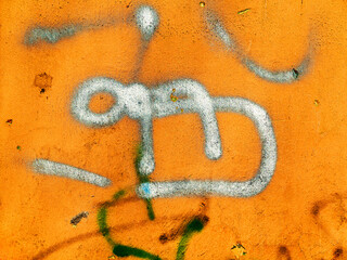 Great colorful background or texture. Abstract concrete aged with cracks, scratches and remnants of old paint in different shades. Bully smeared paint on the walls of an old building. Rough surface