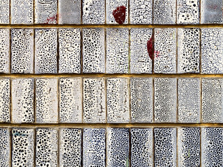 Abstract ceramic tile, weathered with cracks and scratches. Landscape style. Surface roughness. Great background or texture.