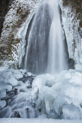 Fototapeta na wymiar Wahkeena falls following an ice storm in the Columbia River Gorge, east of Portland, Oregon