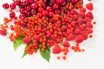 Assorted berry on a white background. Cherries, raspberries, red currants.