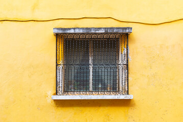 Window with yellow facade in the yellow city of Izamal, Yucatan Peninsula, Mexico.
