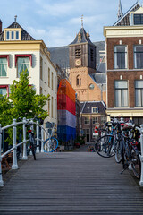 Fototapeta na wymiar The construction site in the center of the Leiden covered by a plastic foil in the colors of the national flag of the Netherlands