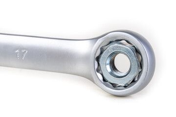 Wrench and metal nut. Accessories for mounting metal elements.