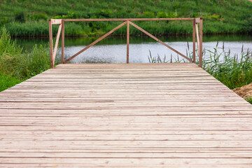 Small wooden dock in a lake. Perspective view
