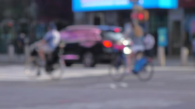 burry photo of unrecognized people sightseeing  at midtown, times square NYC