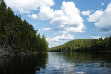 Beautiful Saturated Scenic Summer Landscape Of lake Under Blue Sky With Clouds In Brightly Sunny Day In Isojarvi National park.
