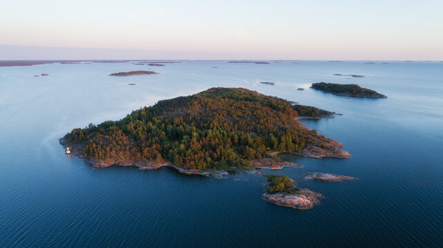 Aerial view over Archipelago Sea National Park Saaristomeri. Beautiful sunset sky. Finland.