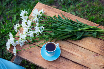 coffee, flowers in the wood nature background