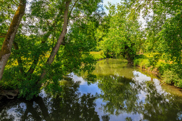 Fototapeta na wymiar Beautiful green landscape on the Eure River in Central France..