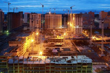 Construction site at night. New buildings
