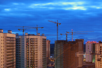 Fototapeta na wymiar Construction site at night. New buildings
