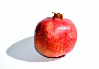 Single Pomegranate isolated with white background and copy space.