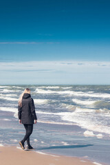 Woman walking on the beach