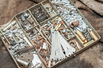 Capacity with departments for folding various small things in the form of bolts, screws, anchors
