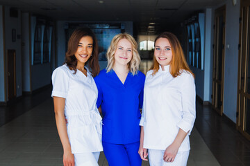Smiling group of young medical students with mixed-race in university. A staff of professional nurses. Advanced training school