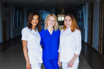 Naklejka premium Smiling group of young medical students with mixed-race in university. A staff of professional nurses. Advanced training school