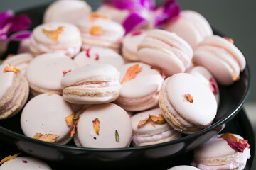 Pale pink macaroons with flower petals         