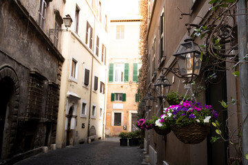 Fototapeta na wymiar Flowered streets of Rome in summer