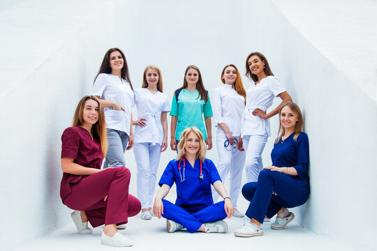 Smiling Group Of Young Medical Students With Mixed-race. A Staff Of Professional Nurses. Advanced Training School