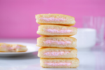 A stack of strawberry mini cakes