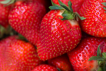 Ripe strawberries as a background texture closeup. Macro.