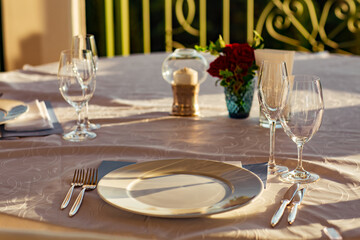beautiful table setting, with dishes, food, in a summer cafe