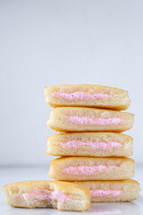 A stack of strawberry mini cakes