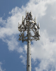 a tower full of cell phone communication equipment