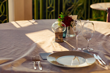 beautiful table setting, with dishes, food, in a summer cafe