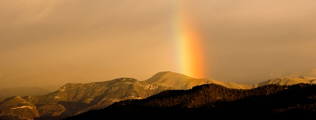 Rainbow over mountains. Pyrenees, Spain