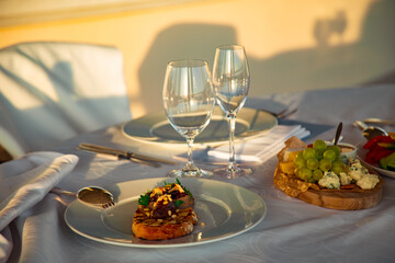 beautiful table setting, with dishes, food, in a summer cafe